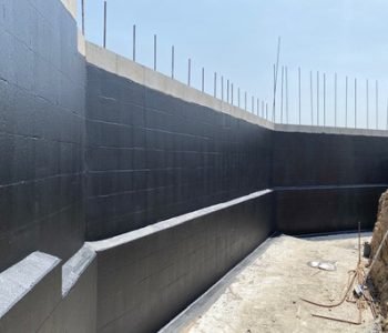 Applying-Waterproofing-Membrane-to-Retaining-Wall